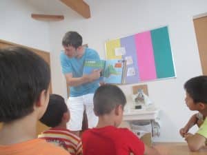 A teacher instructs students about geography