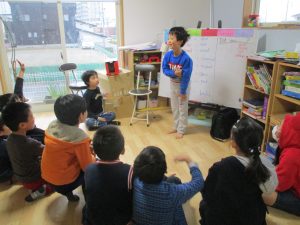 A student leads a grammar lesson