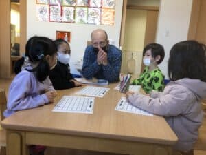 A teacher instructs children on phonics