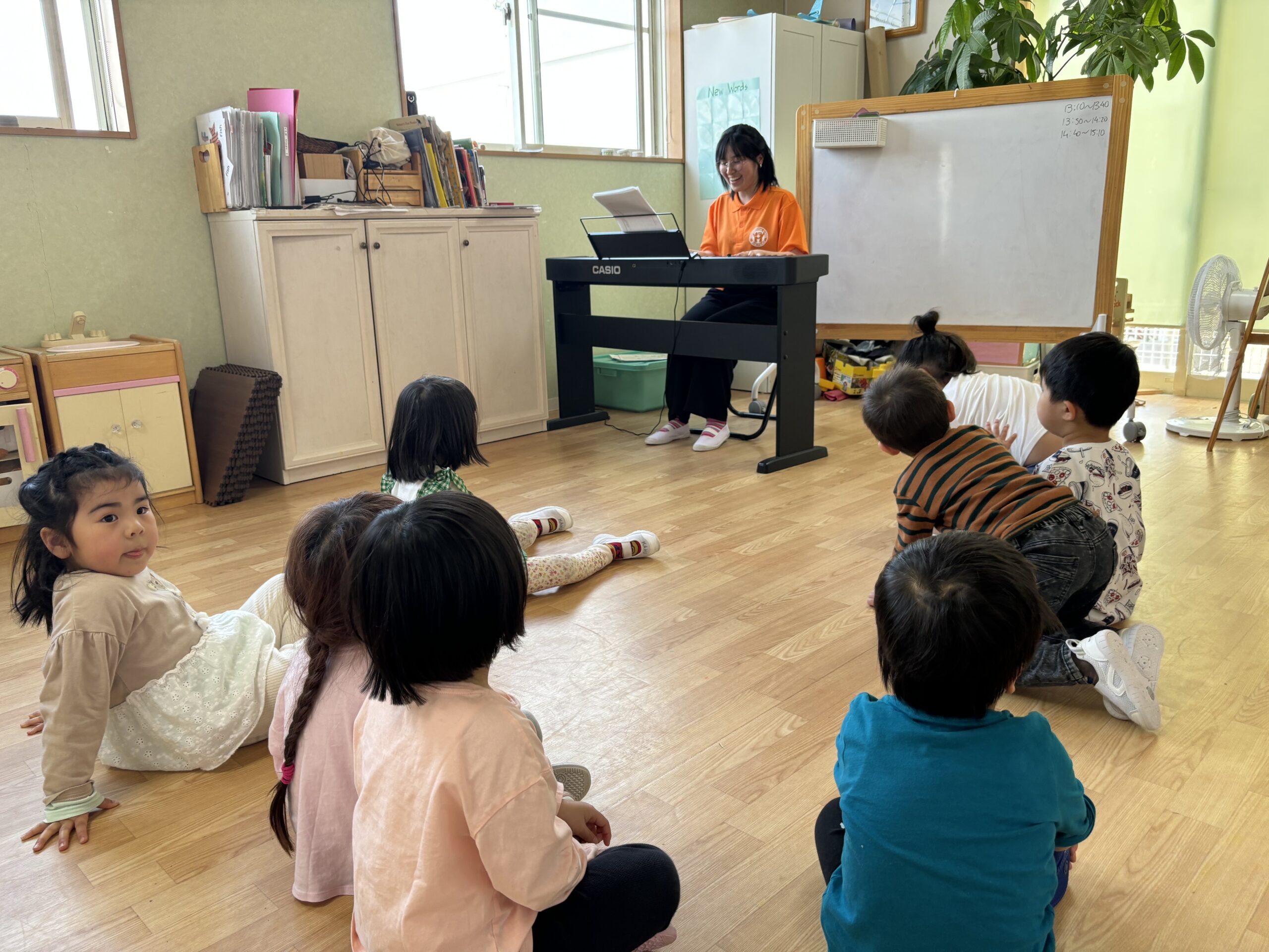 Children enjoying music class at English preschool in Nagoya