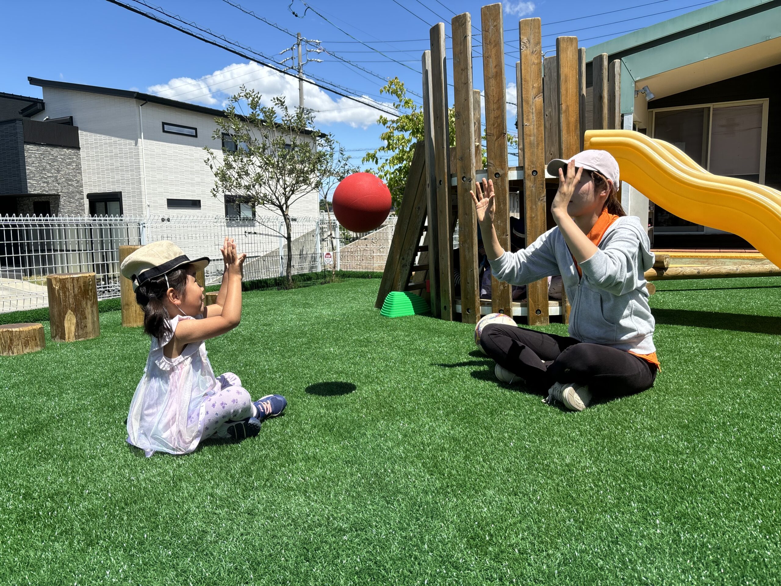 Tossing a ball in the playground at Nagoya International School